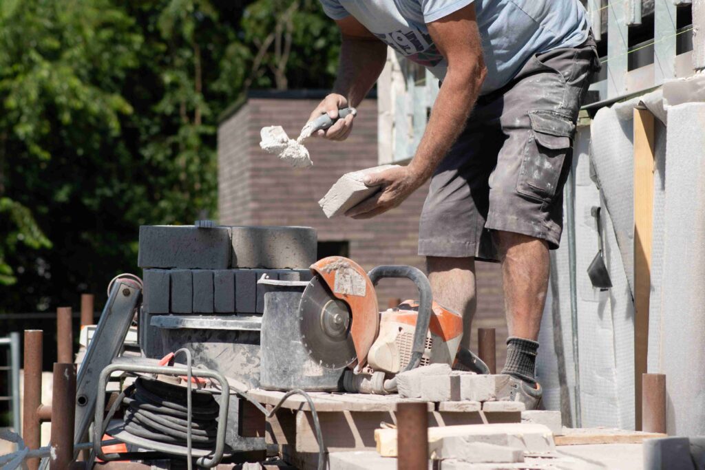 masonry-worker-the-bricklayer-makes-the-facade-of-2023-03-30-00-50-41-utc (1)